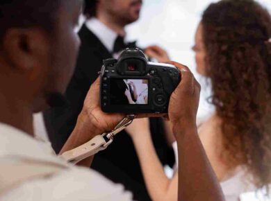 Professional videographer capturing ceremony vows for wedding videography deliverables