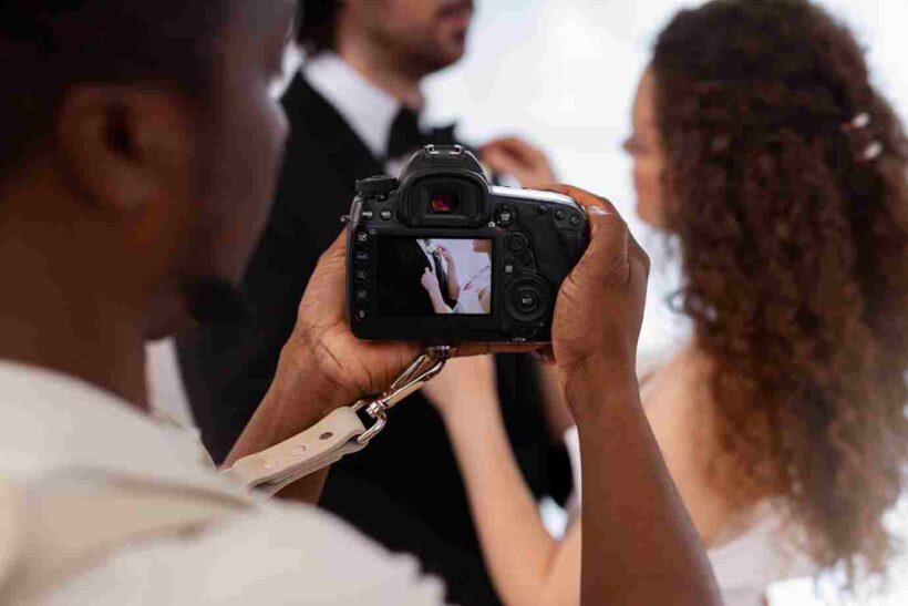 Professional videographer capturing ceremony vows for wedding videography deliverables