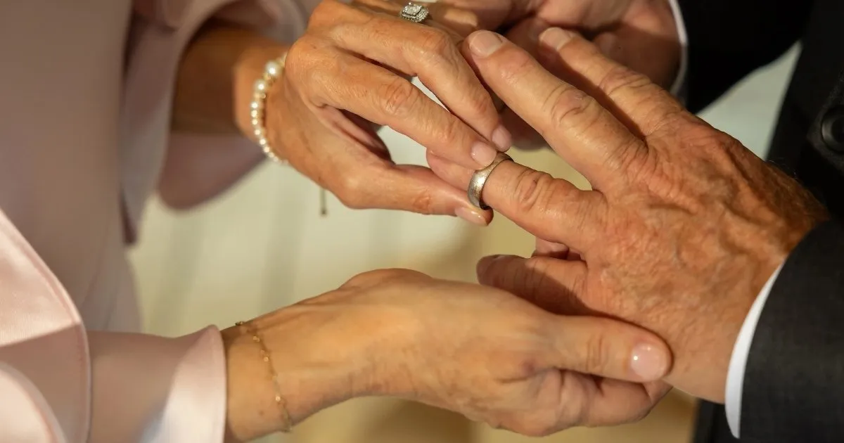 Bride and groom exchanging wedding rings in Acworth GA — wedding photography by 247 Digital Media