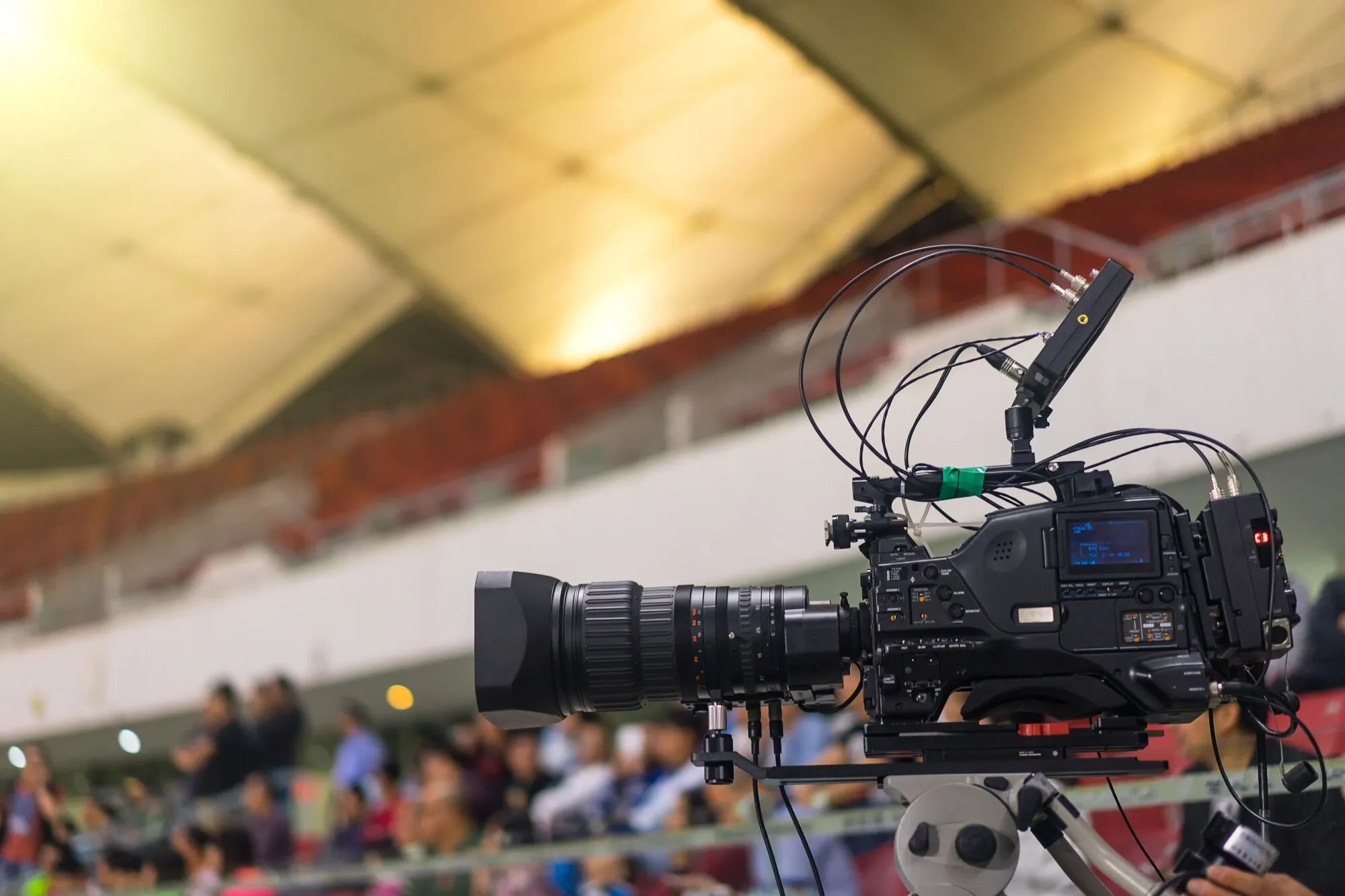Camera operator filming a panel discussion for a hybrid event live stream in Atlanta