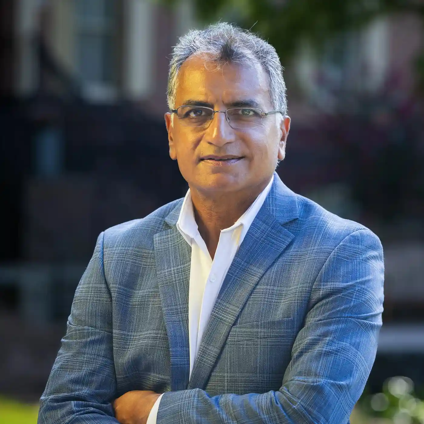 Professional corporate headshot of an executive against a gray studio backdrop in Atlanta