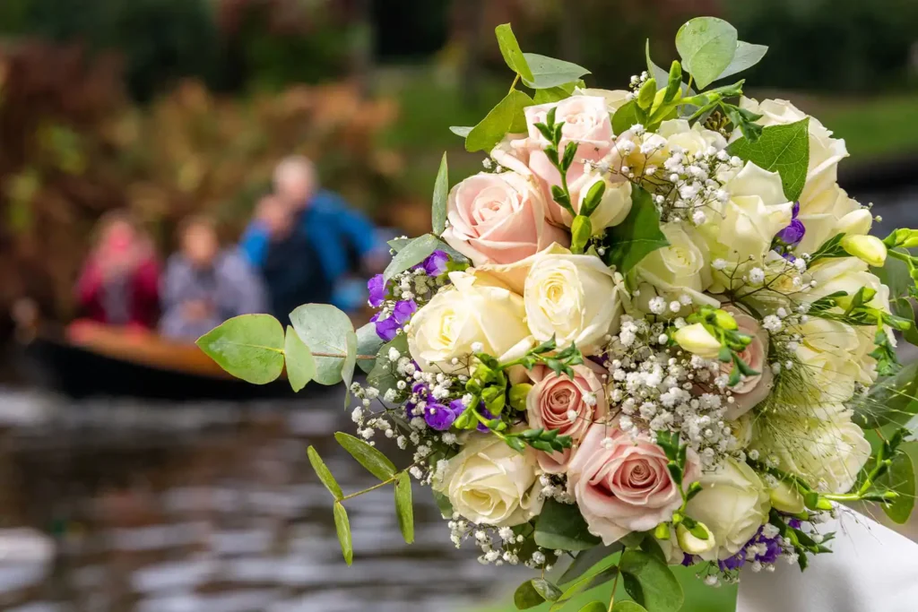 Pastel rose bridal bouquet with white flowers and greenery
